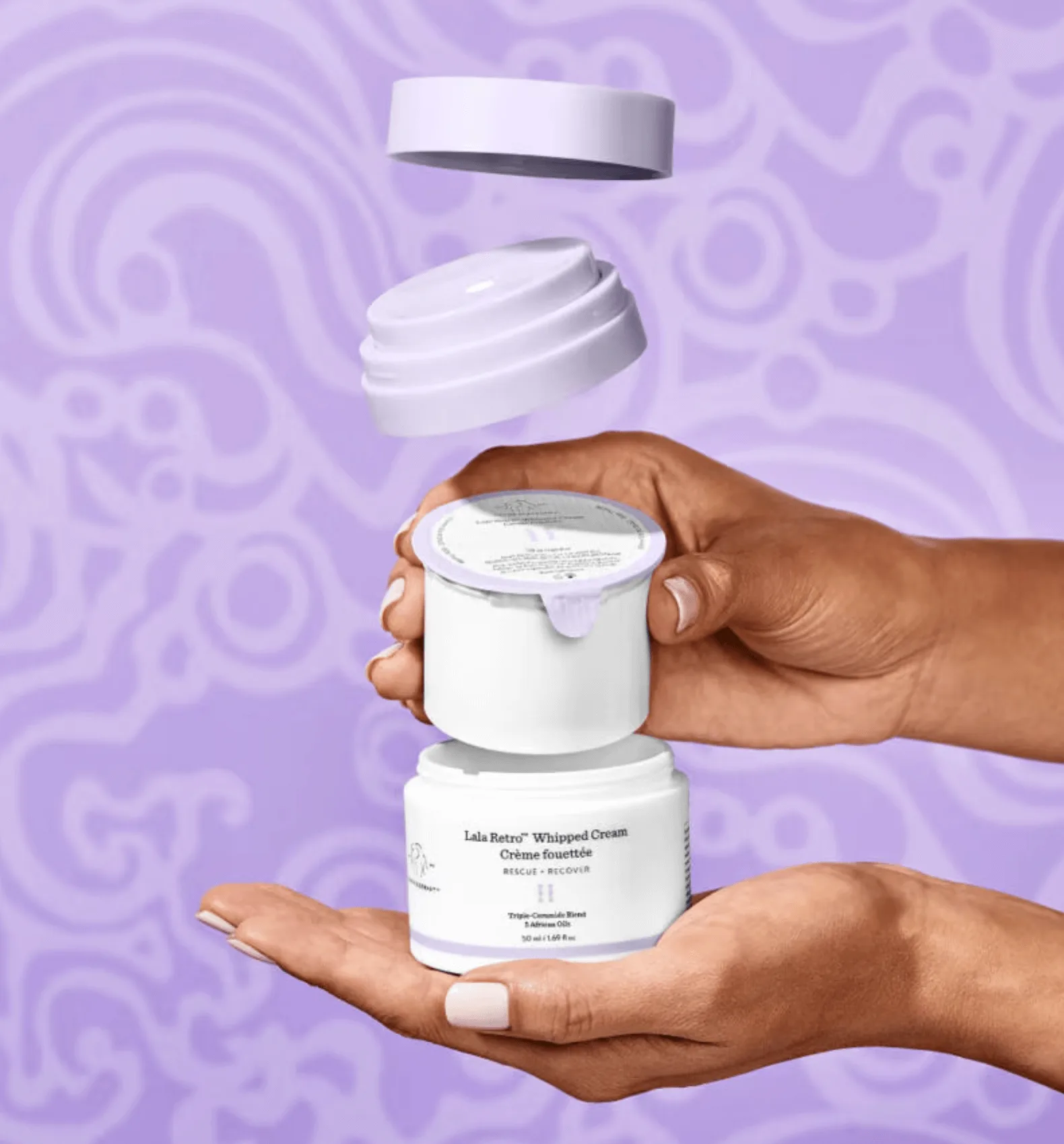 Hands holding exploded refillable jar packaging with lid and inner seal on purple background design.