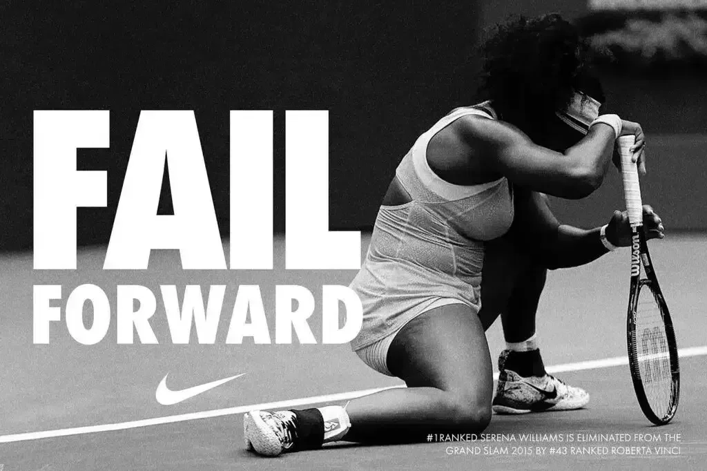 Black and white Nike advertisement featuring Serena Williams kneeling with her head down on a tennis court, accompanied by the bold slogan 'FAIL FORWARD'. The text highlights her 2015 Grand Slam loss to Roberta Vinci, emphasizing resilience through failure.