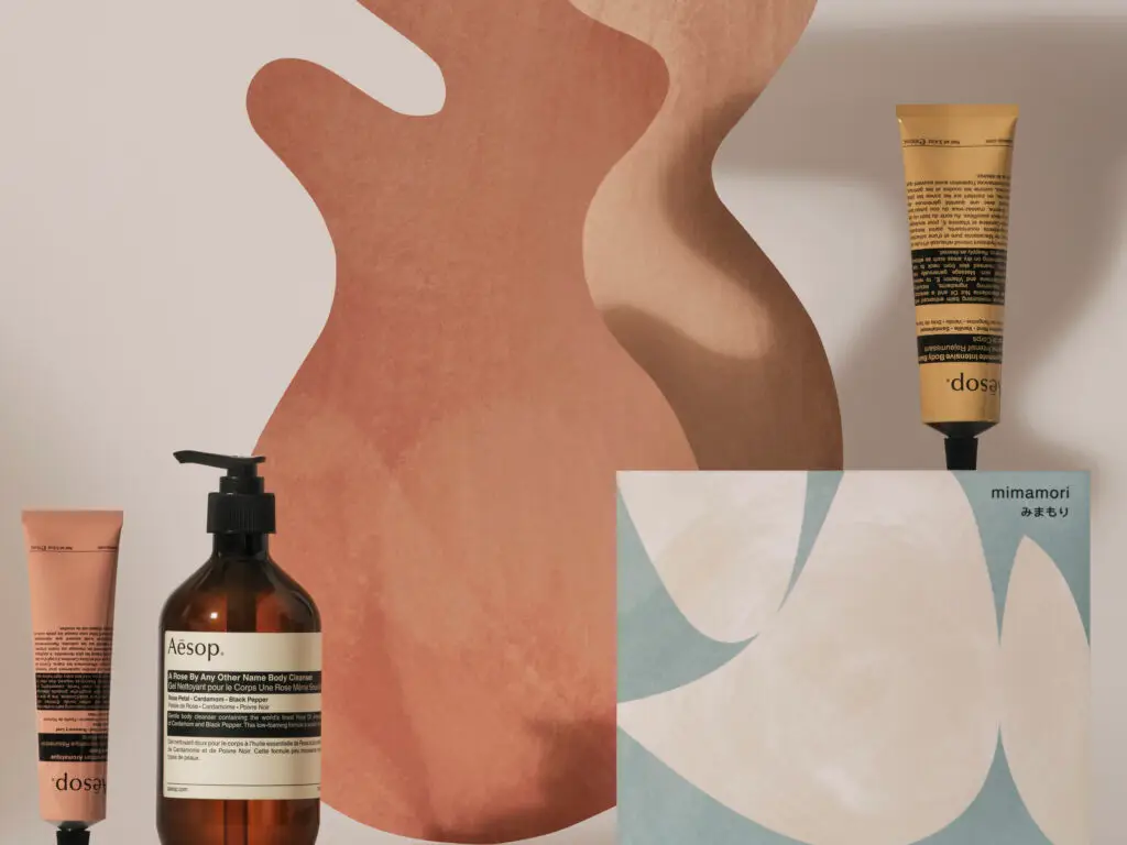Minimalist display with Aesop products, abstract earthy shapes, and soft muted color tones.