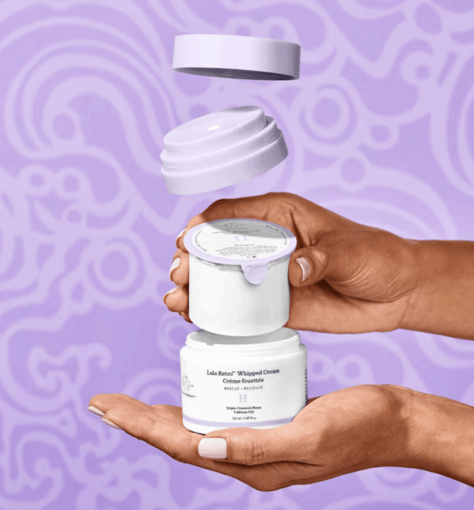 Hands holding exploded refillable jar packaging with lid and inner seal on purple background design.