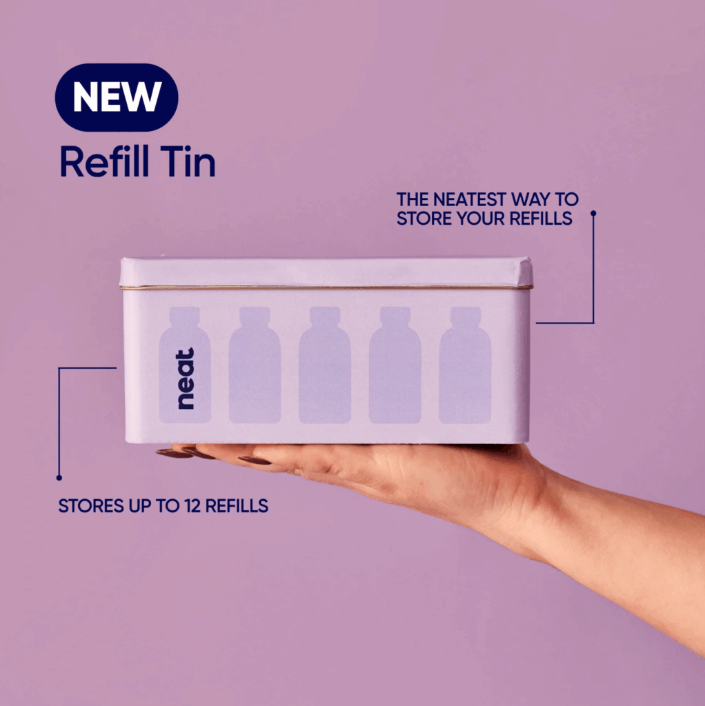Hand holding Neat Refill Tin with 'Stores up to 12 refills' and purple background.
