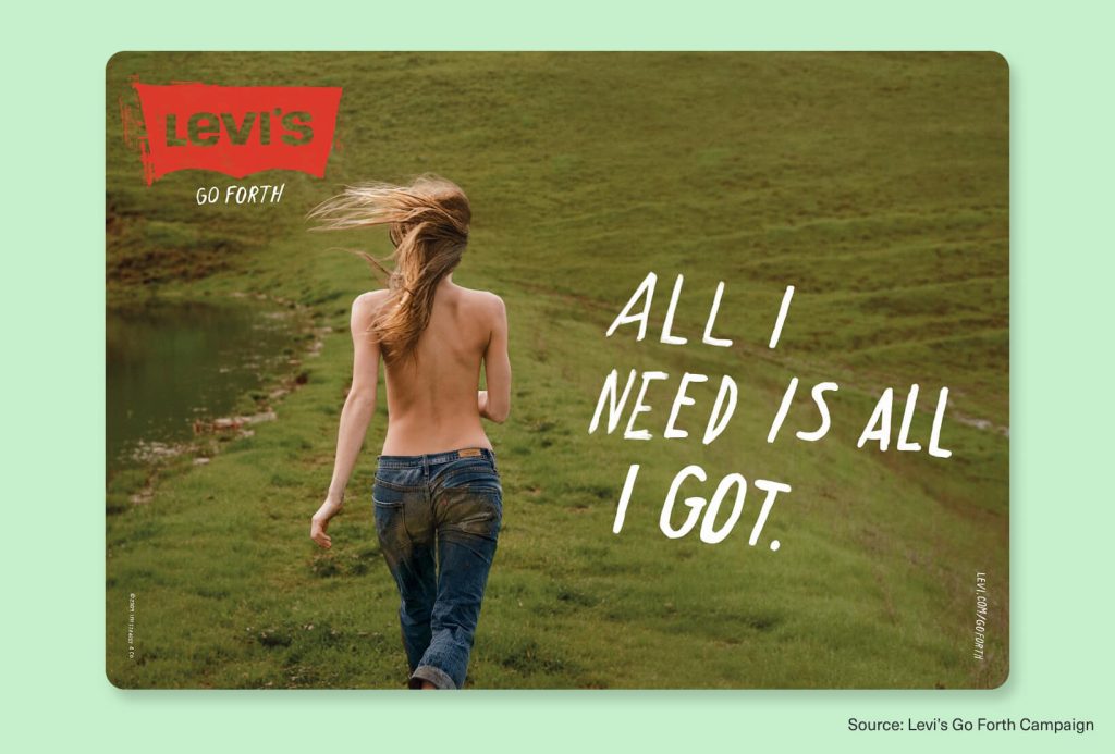 Levi’s Go Forth campaign ad showing a woman in jeans walking through a green field with the slogan All I Need Is All I Got