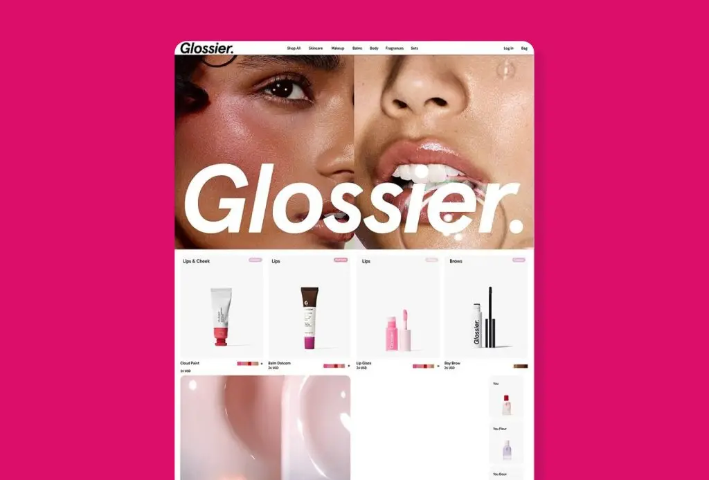 Glossier website design example featuring soft product visuals, approachable beauty branding, and a clean ecommerce layout